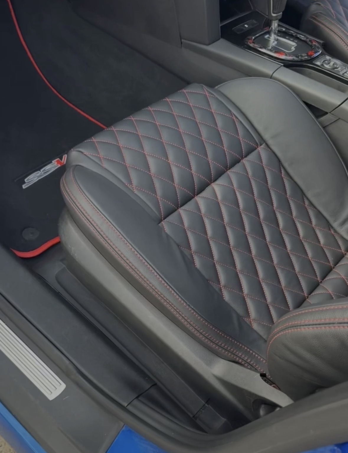Interior — leather & carpet detail after
